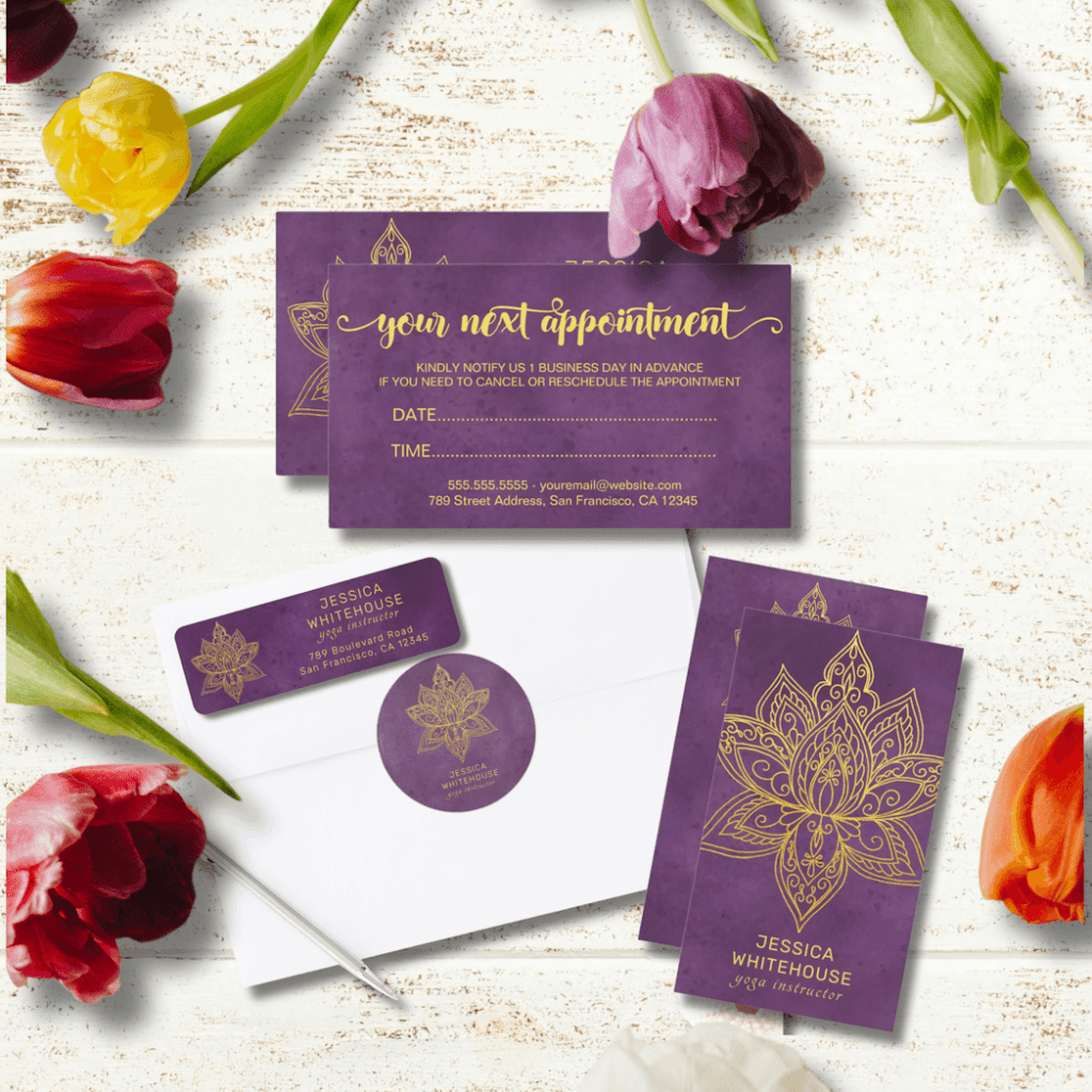 A display of different business supplies with a common theme, purple background and lotus mandala in gold.