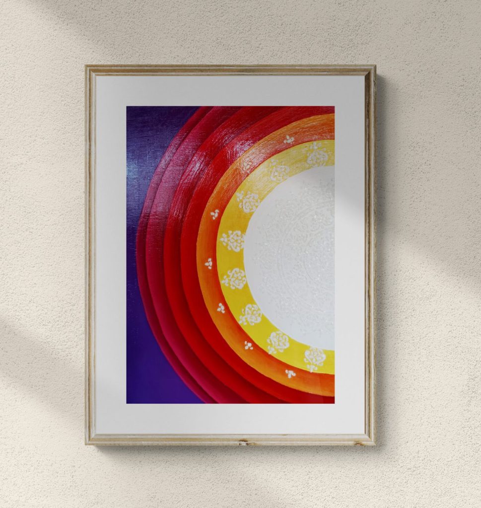 A framed painting representing half Sun Mandala with feminine colors