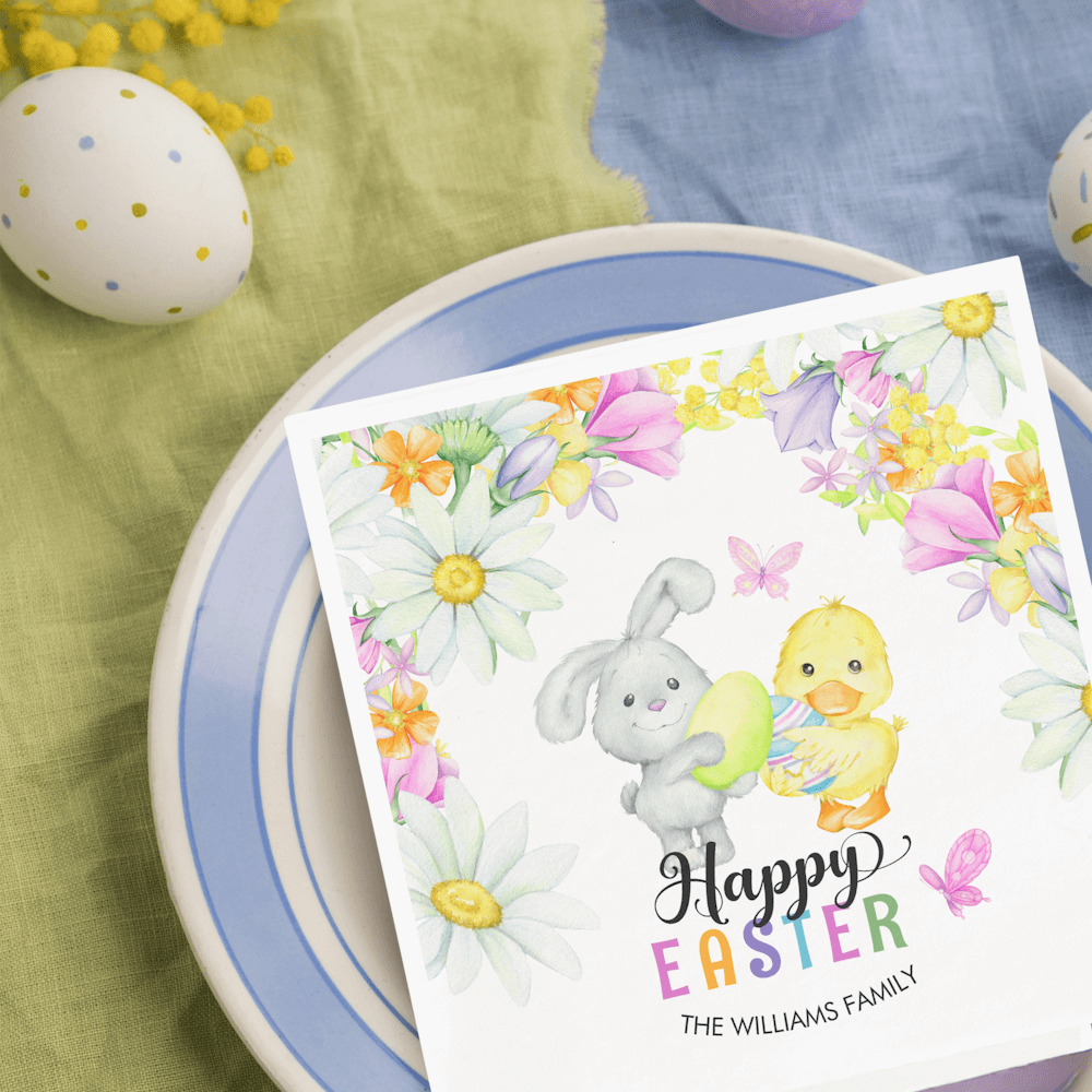 Happy Easter Paper Napkins featuring a cute bunny and a chick holding easter eggs surrounded by spring flowers, butterflies and a colorful text.