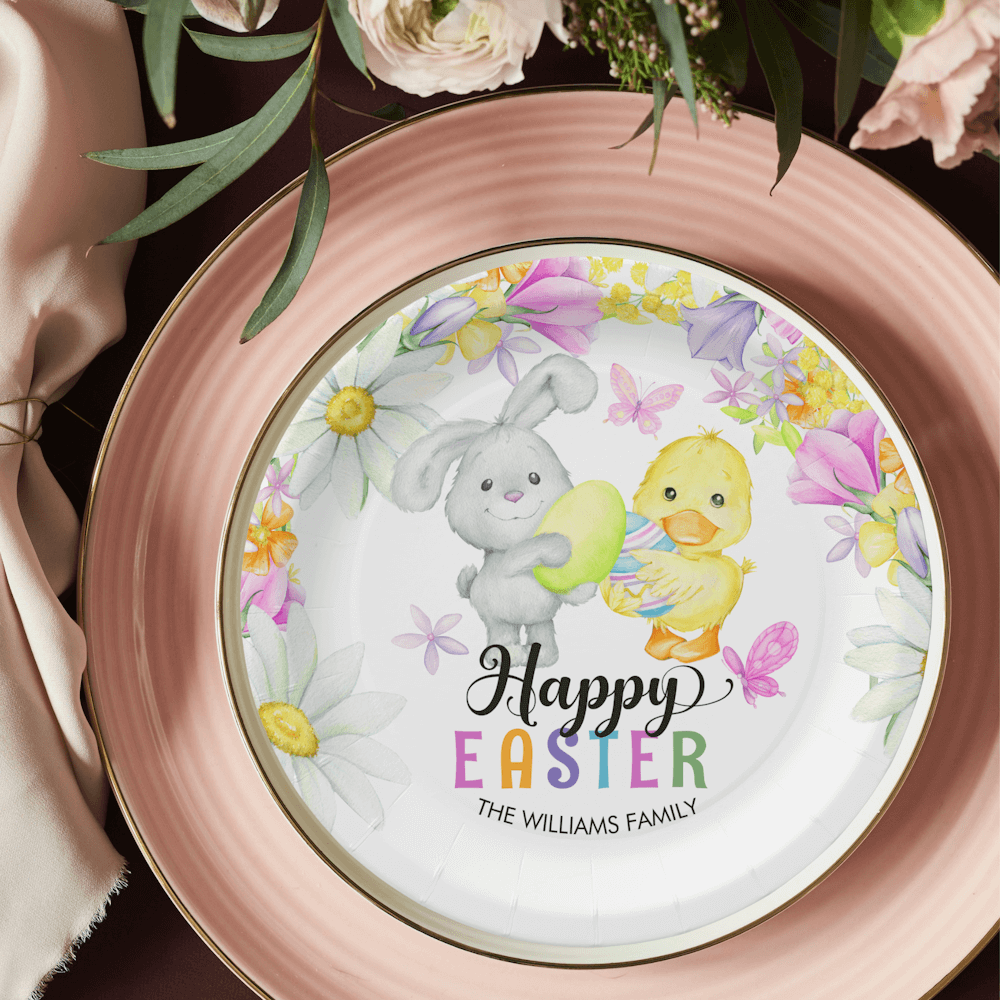 Happy Easter Paper Plates featuring a cute bunny and a chick holding easter eggs surrounded by spring flowers, butterflies and a colorful text.