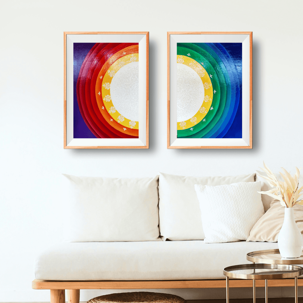 Two paintings on top of a sofa representing two halfs of the Sun Mandala with Feminine and Masculine colors.